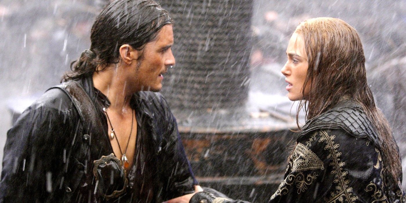 Will and Elizabeth staring at each other under the rain in Pirates of the Caribbean 3