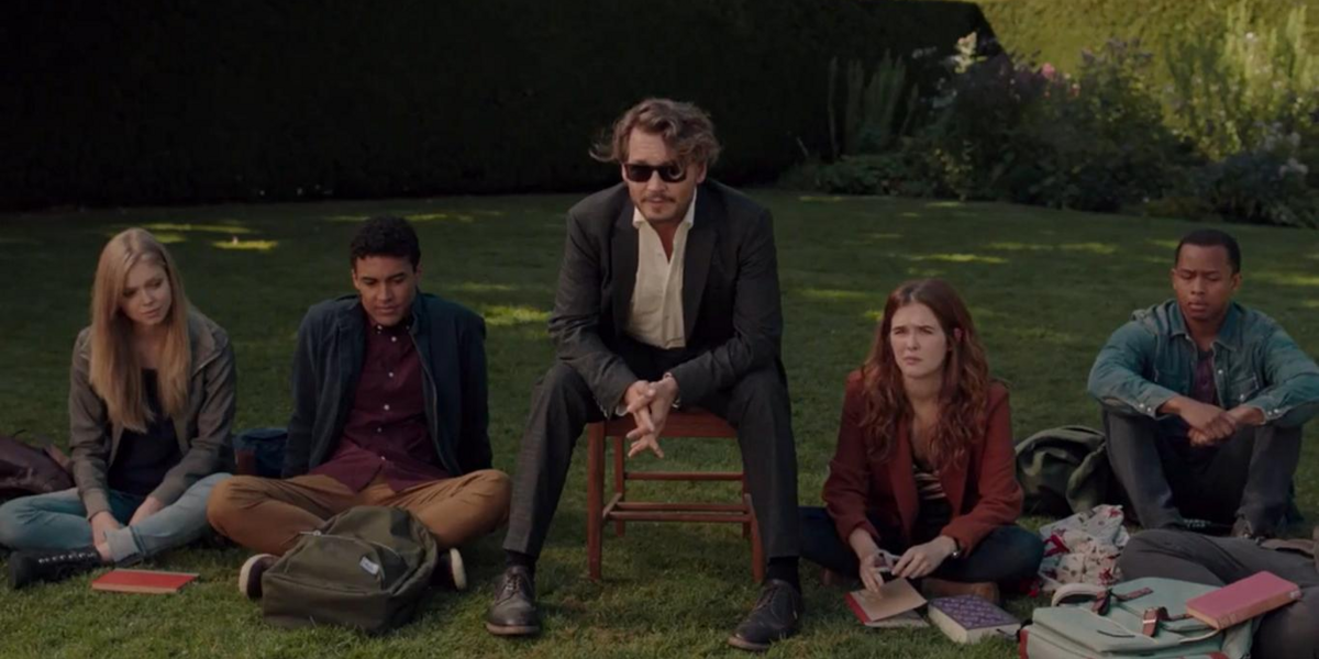 Johnny Depp sits with students, one played by Zoey Deutch