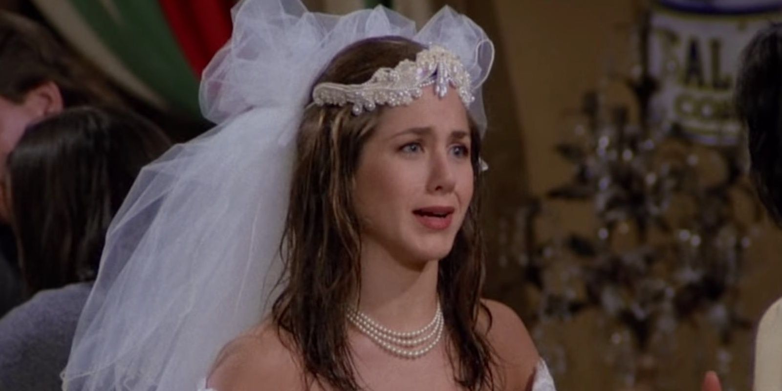 Rachel in a wedding dress talking to Monica in Friends