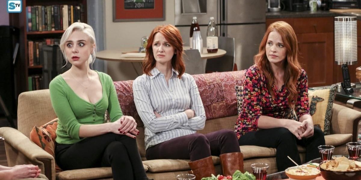 Claire, Emily Sweeney, and Emily sitting on Raj's couch looking confused in The Big Bang Theory
