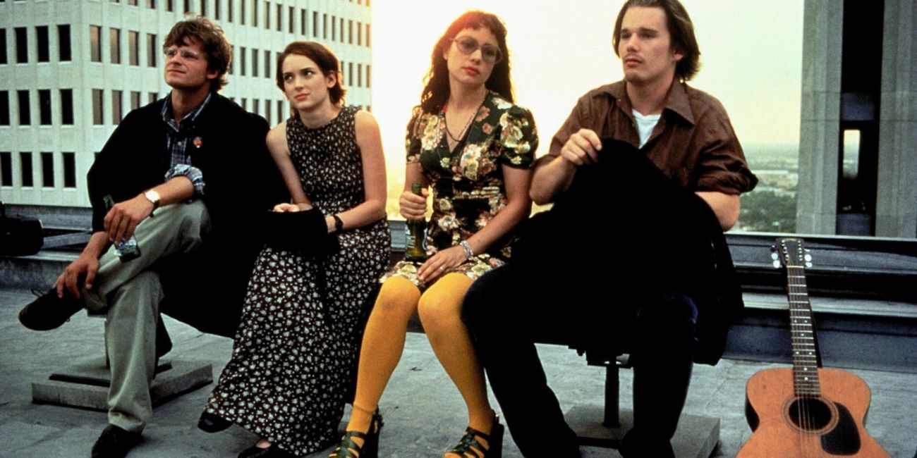 Sammy, Lelaina, Vicky, and Troy sitting on the street in Reality Bites