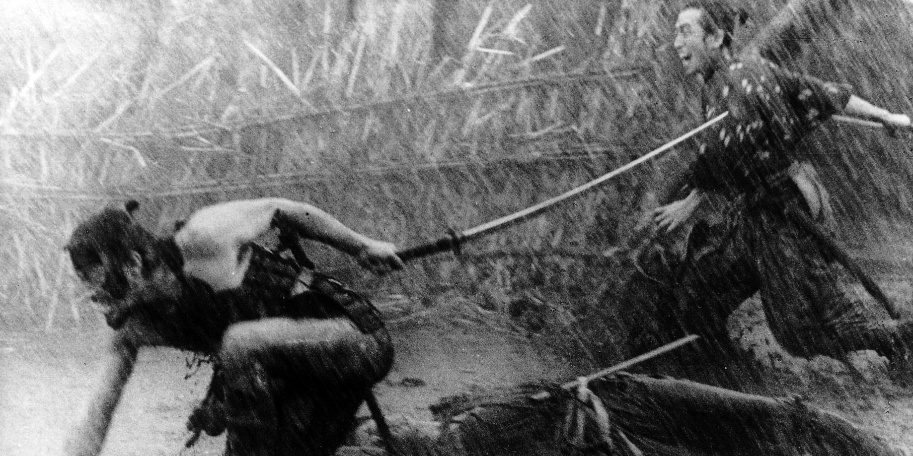 An image of two characters fighting in the rain in the Seven Samurai
