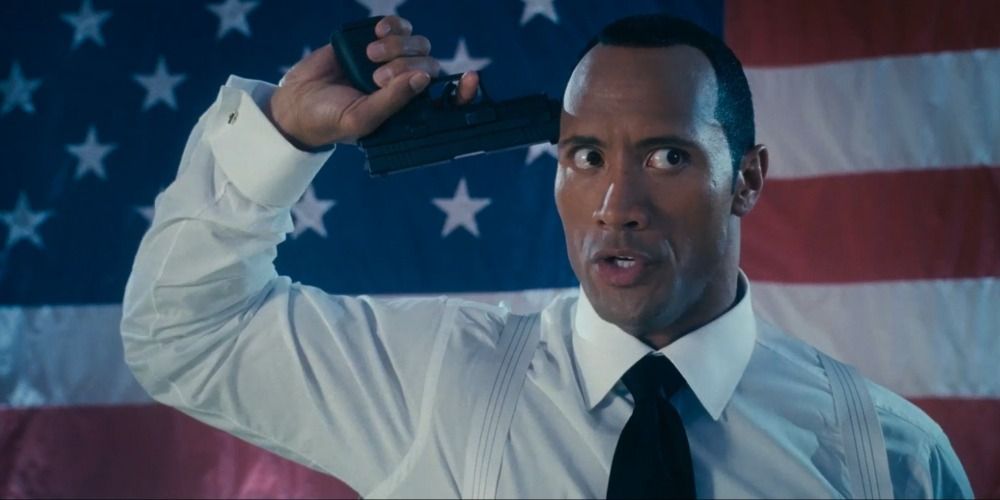 Boxer holds a gun to his head in Southland Tales (2006)