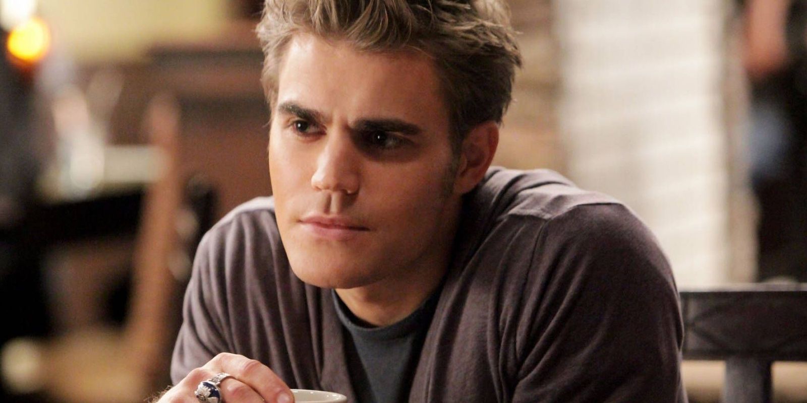 Stefan sitting at the Grill in The Vampire Diaries.