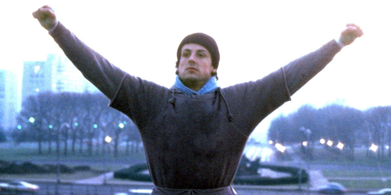 Sylvester Stallone reaches the top of the steps in Rocky