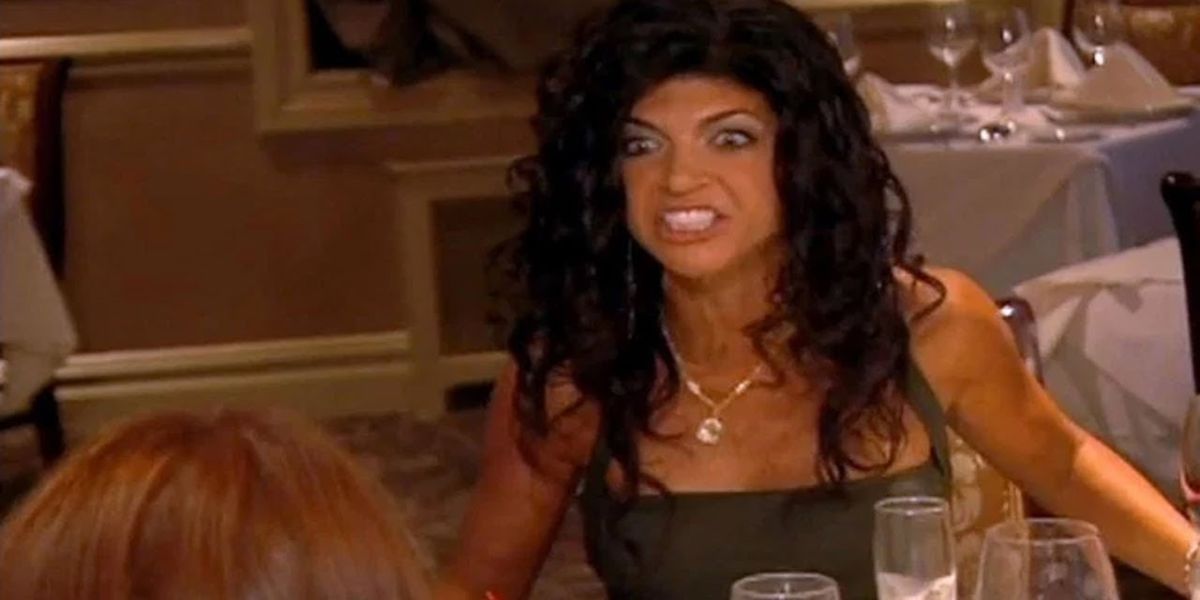 Teresa flipping a table at dinner on RHONJ