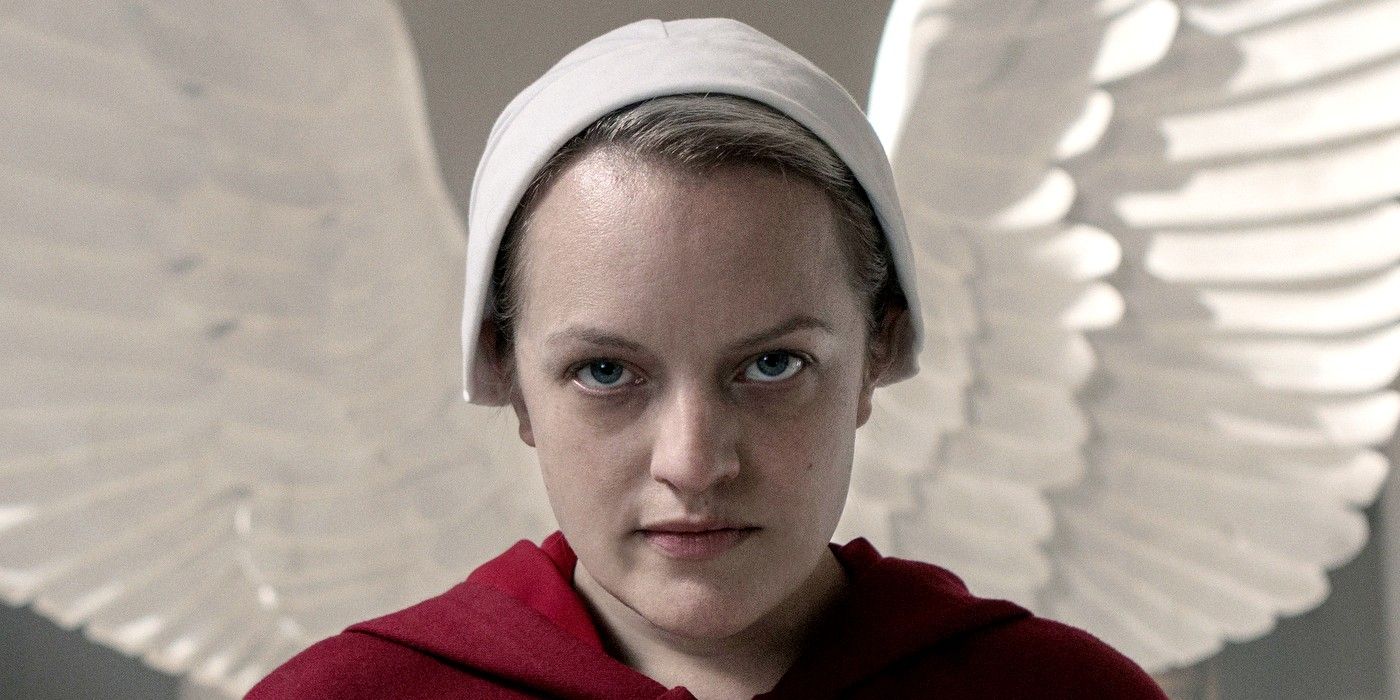 The Handmaid's Tale - June standing in front of angel Wings