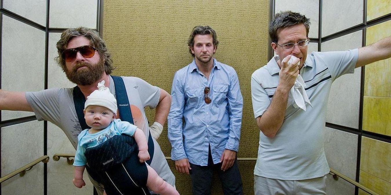 Alan, Phil, Stu, and baby Carlos in the elevator in The Hangover