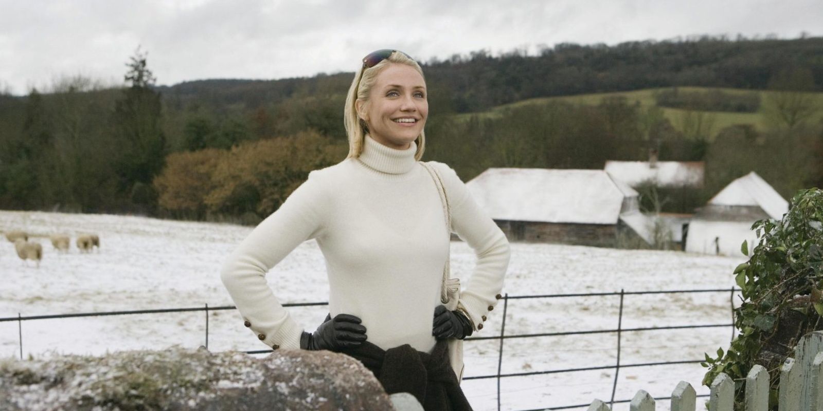 Amanda standing in the English countryside in The Holiday