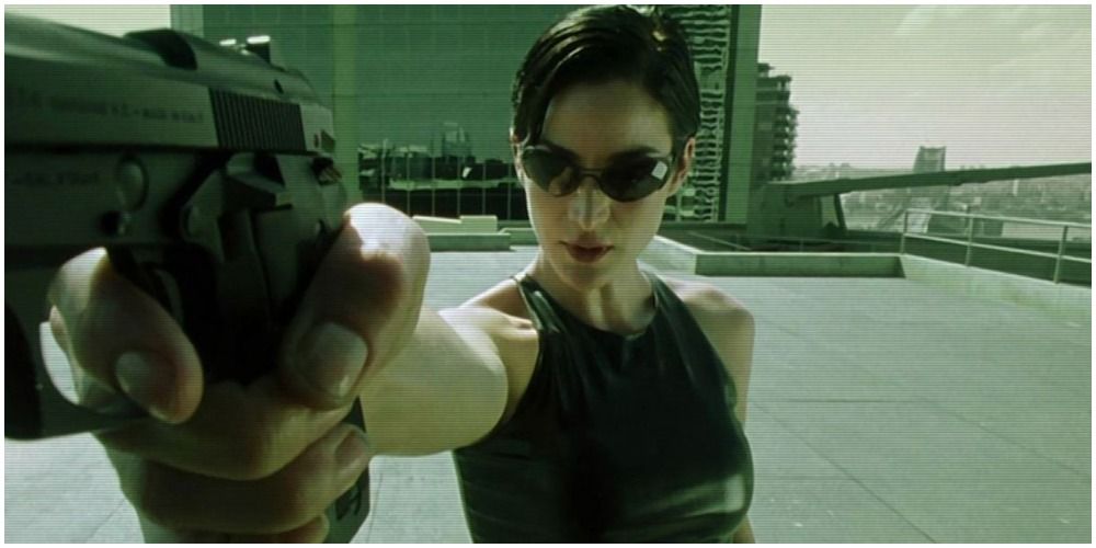 Woman With Sunglasses Holding Gun