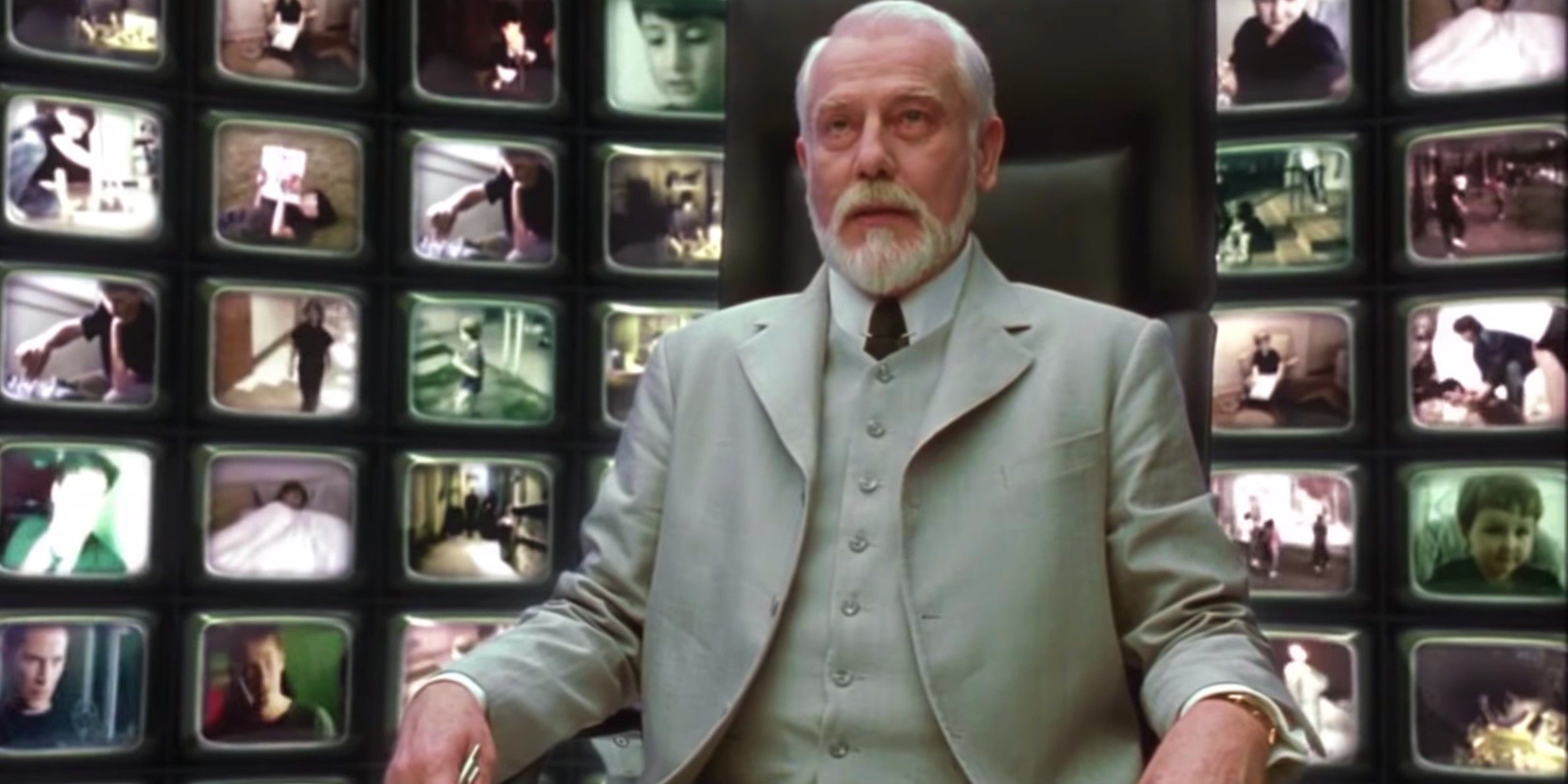 The architect sits in front of dozens of small TV screens in The Matrix Revolutions