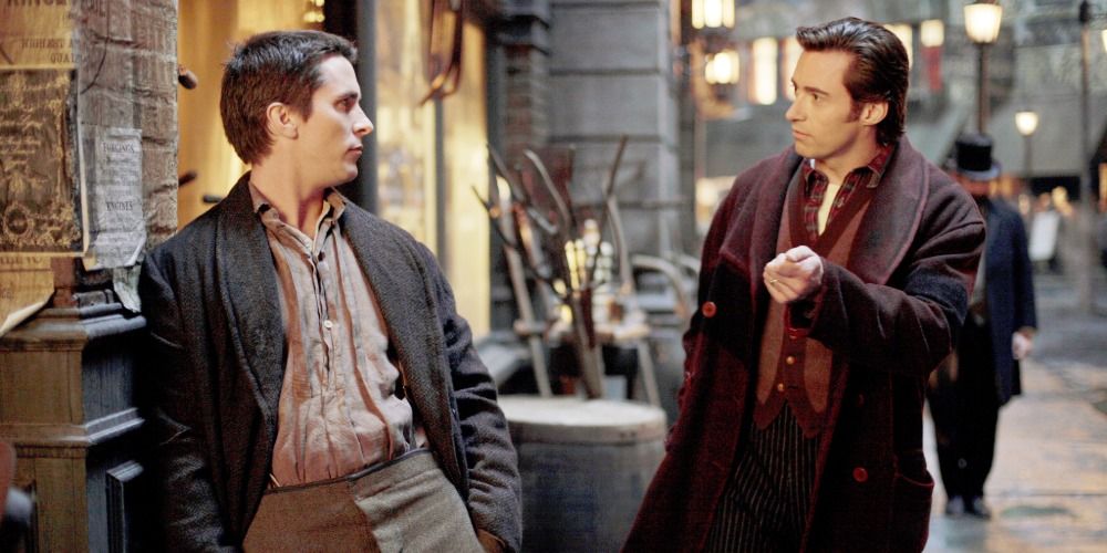 Robert and Alfred talk to each other in the street in The Prestige