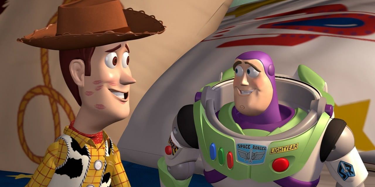 Woody and Buzz sit on Andy's bed in Toy Story