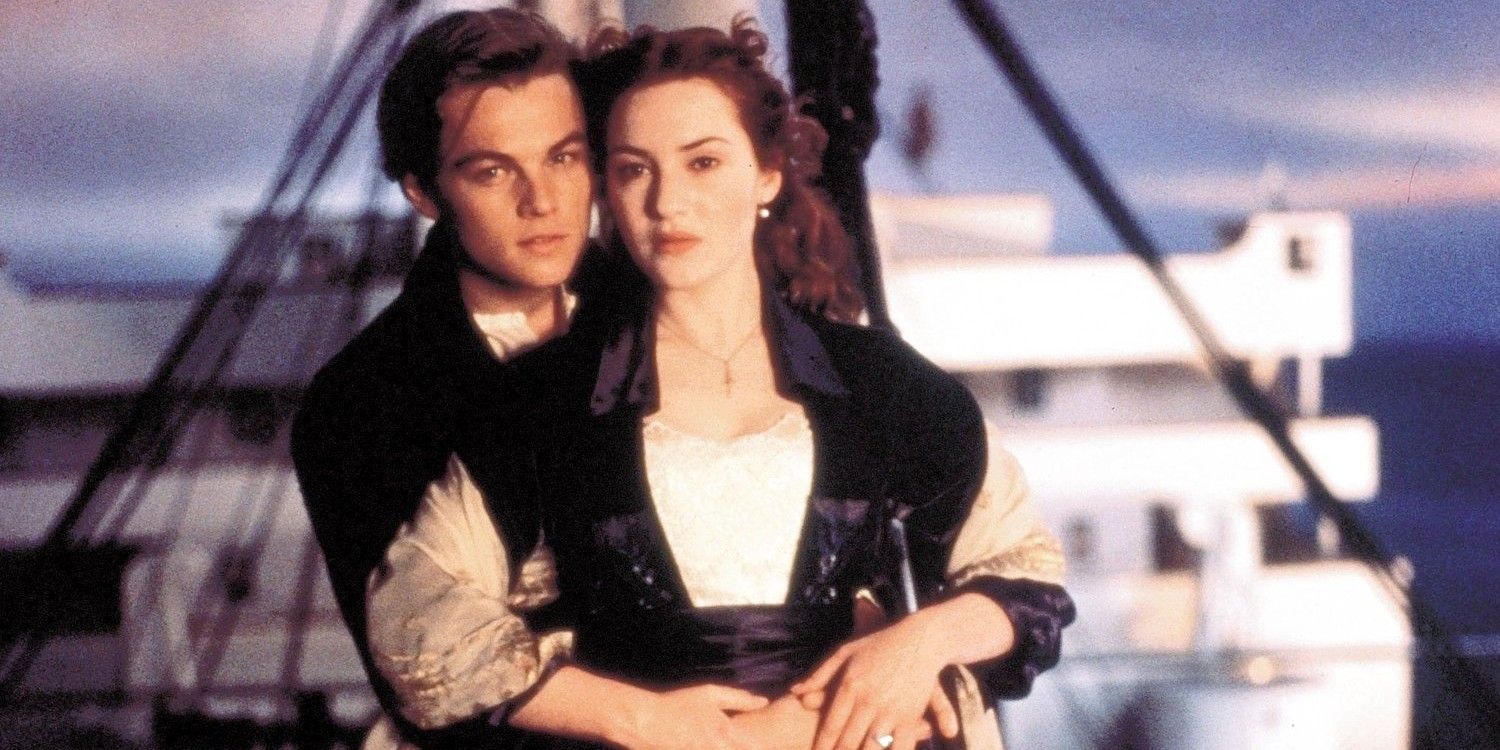 Rose and Jack embrace while standing in the ship's railing in Titanic