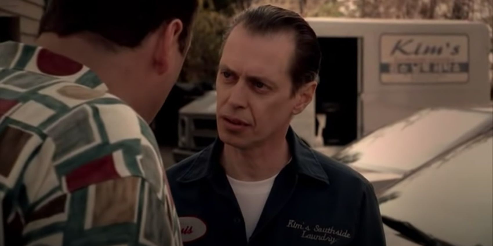 Tony Blundetto wearing a blue jumpsuit in The Sopranos.