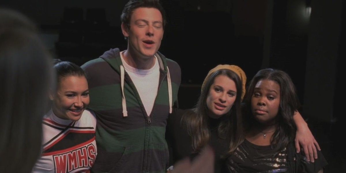 Santana, Finn, Rachel, and Mercedes hugging while singing We Are Young