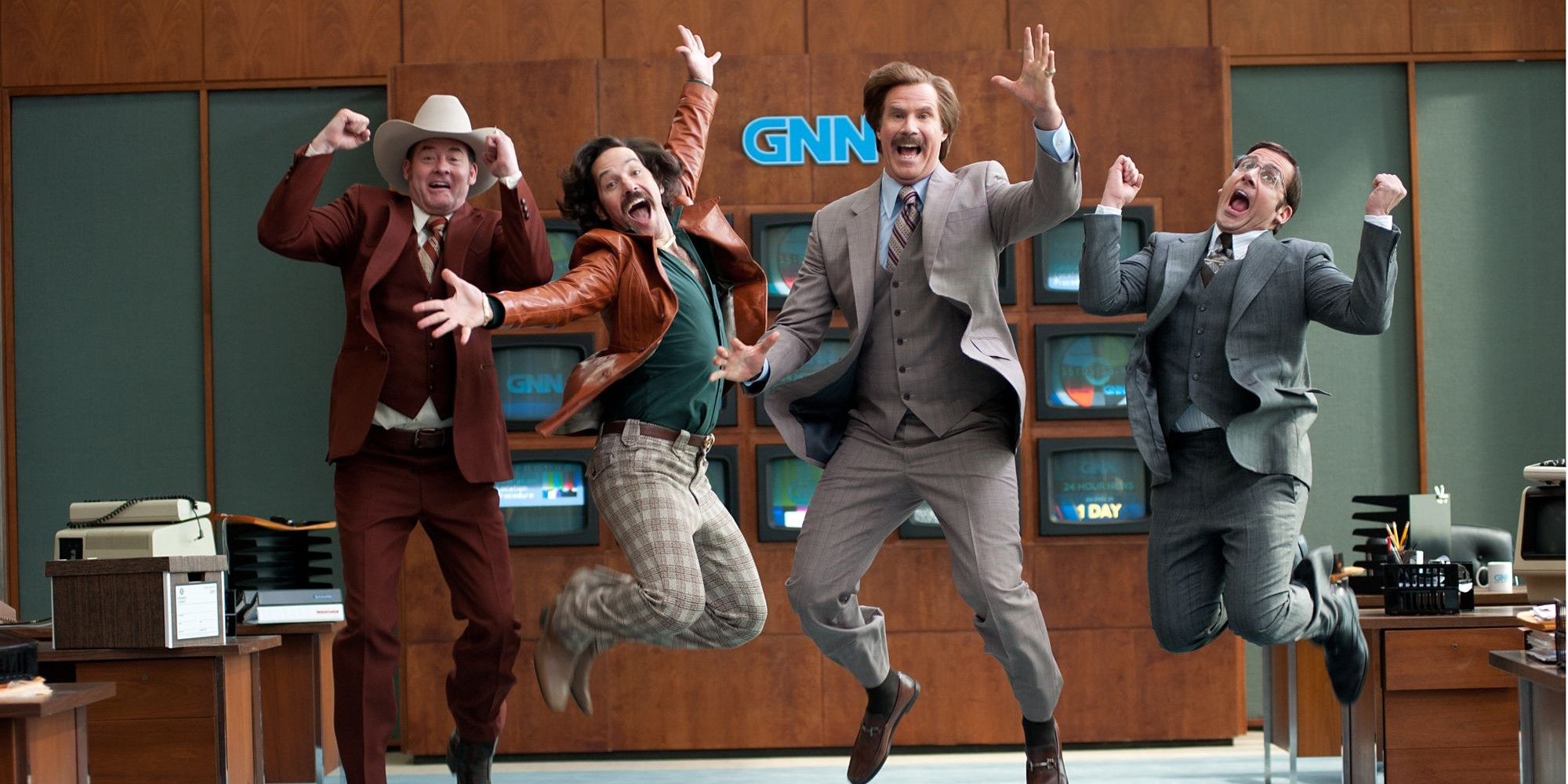 Ron Burgundy and the news team excitedly jump in the air in Anchorman 2: The Legend Continues