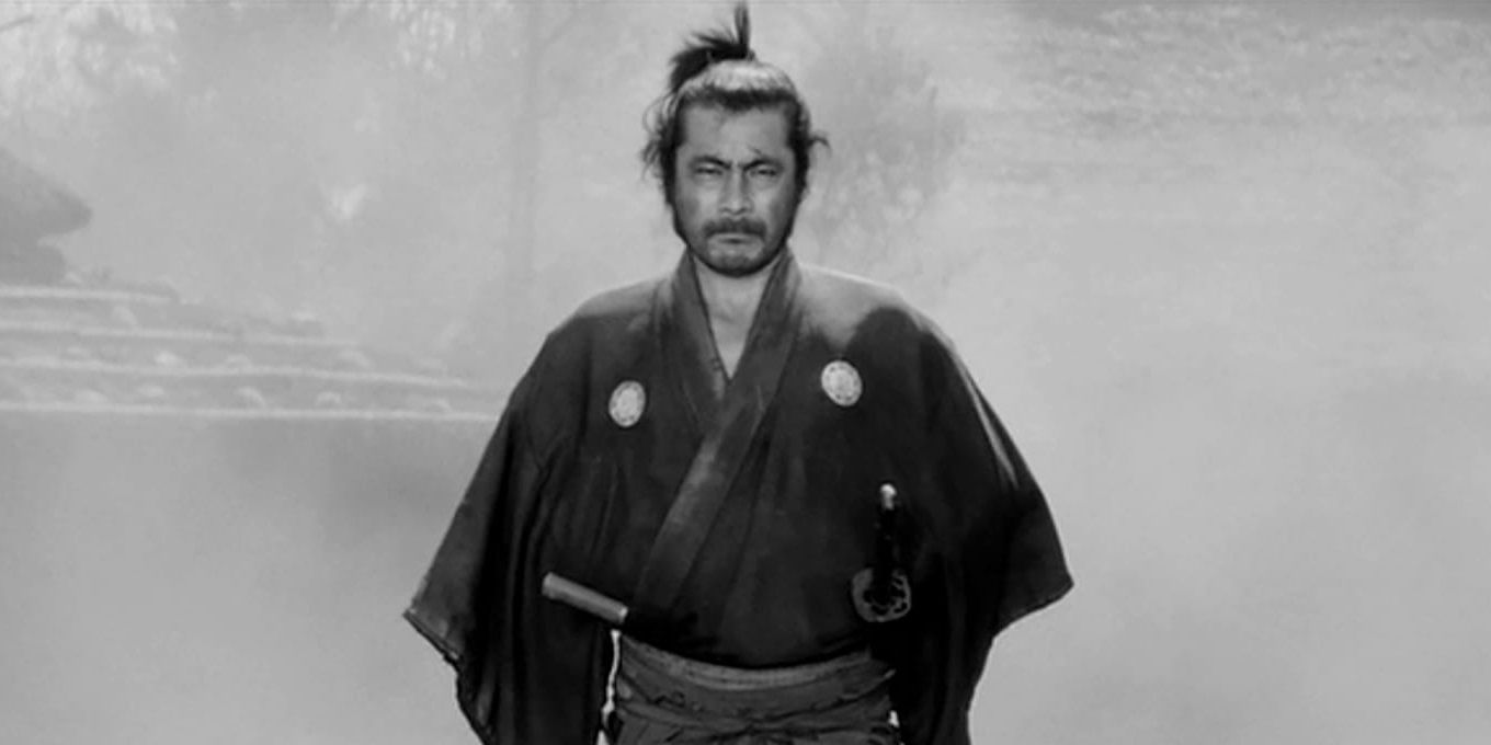 Toshiro Mifune walking through a cloud of smoke in Yojimbo.