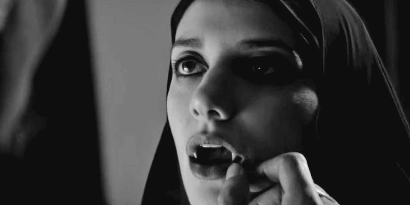 A girl bares her fangs in A Girl Walks Home Alone At Night
