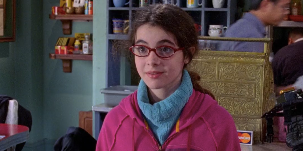 April Nardini standing in Luke's diner on Gilmore Girls