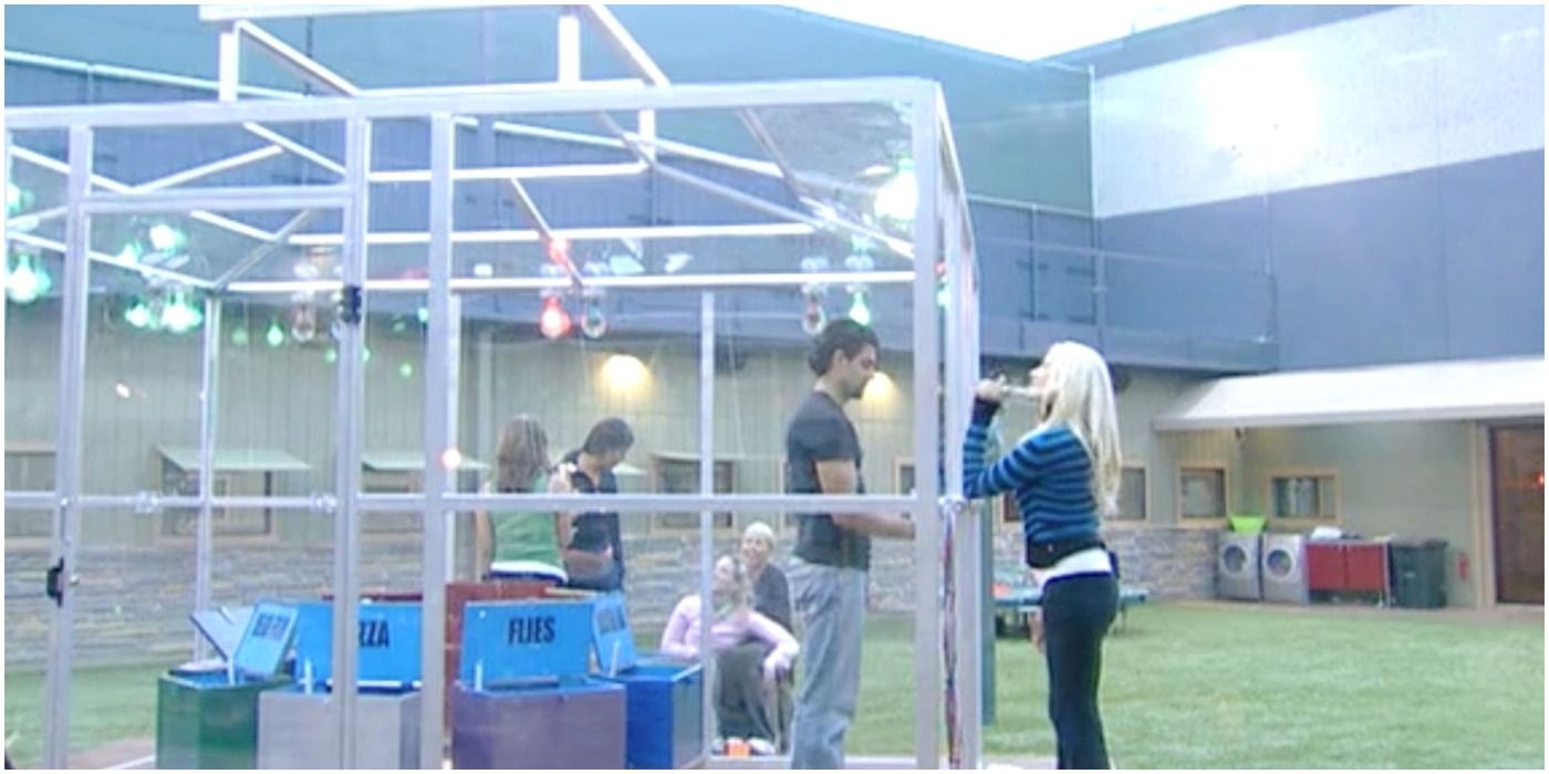 Big Brother players stuck in a box in the backyard in the Pressure Cooker competition.