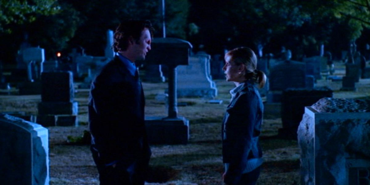 Buffy talking to a vampire in the cemetery