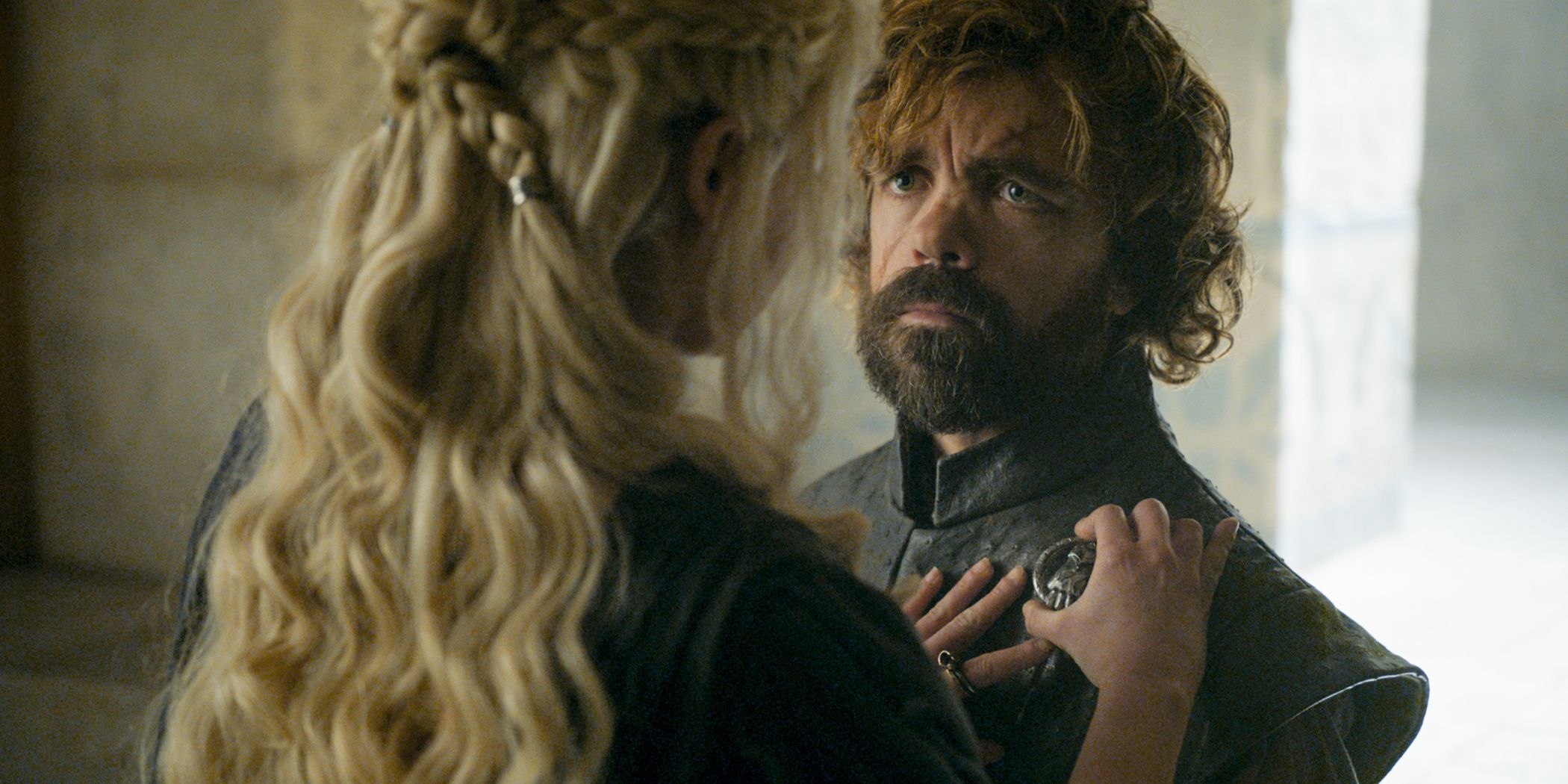 Daenerys pins the Hand of the Queen medal on Tyrion Lannster in Game of Thrones