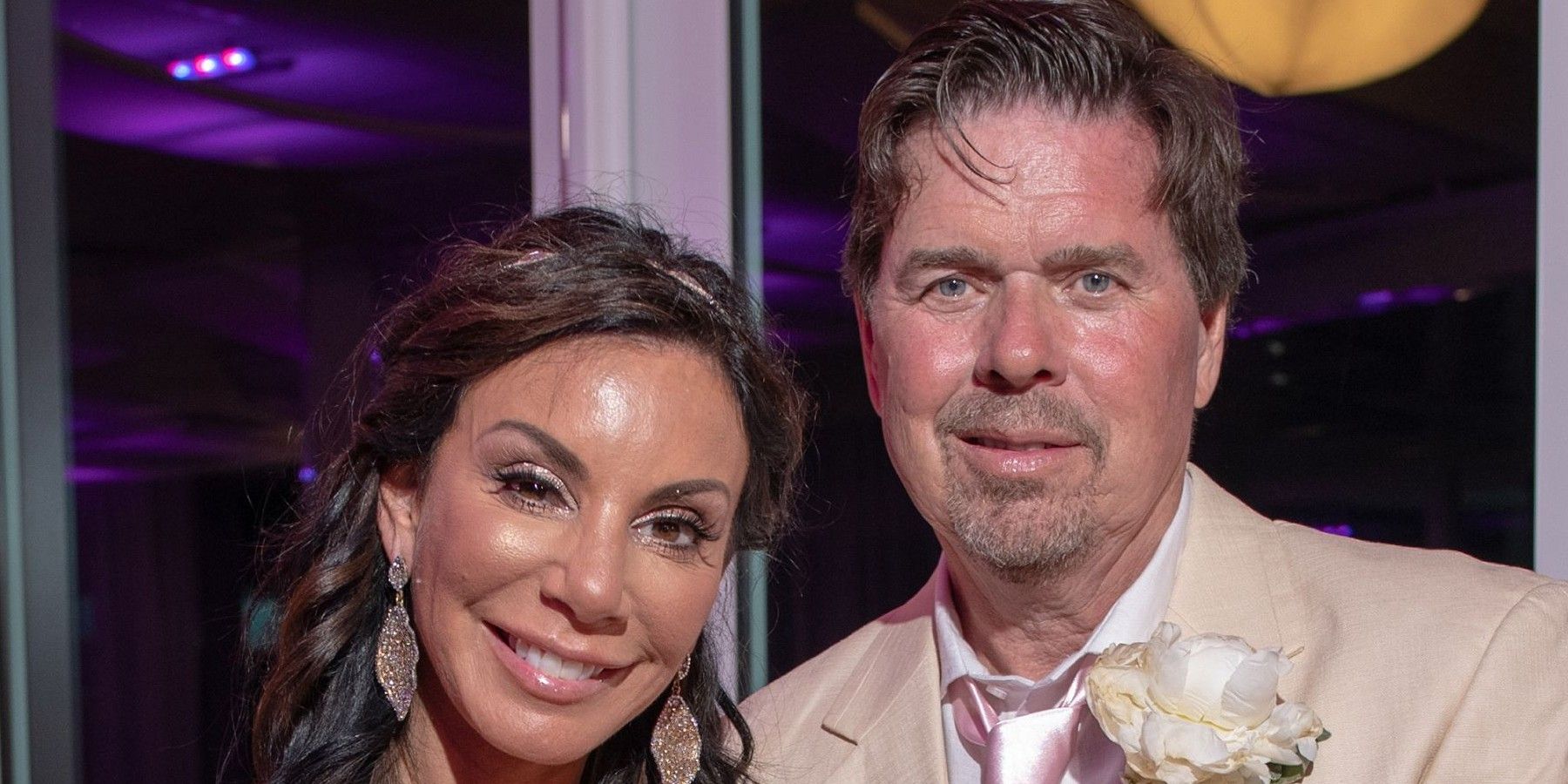 Danielle Staub standing with Marty Cafferty on the Real Housewives of New Jersey