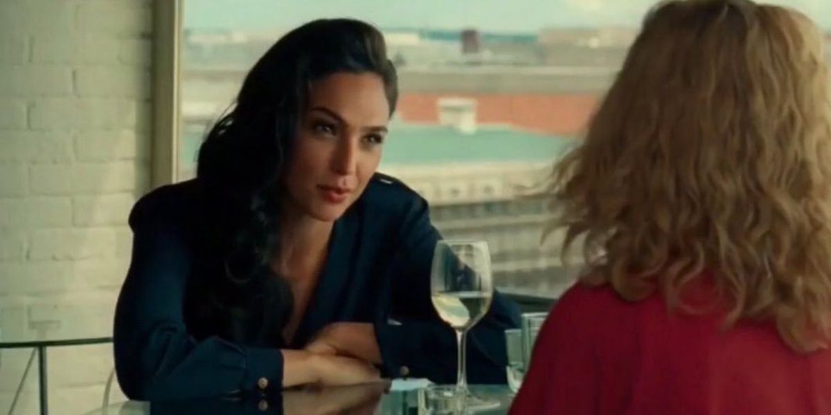 Gal Gadot as Diana Prince and Kristen Wiig as Barbara Minerva on an early dinner date