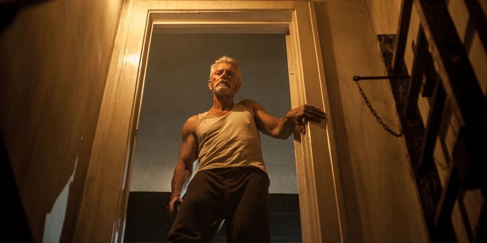 Blind man (Stephen Lang) stands at the top of stairs