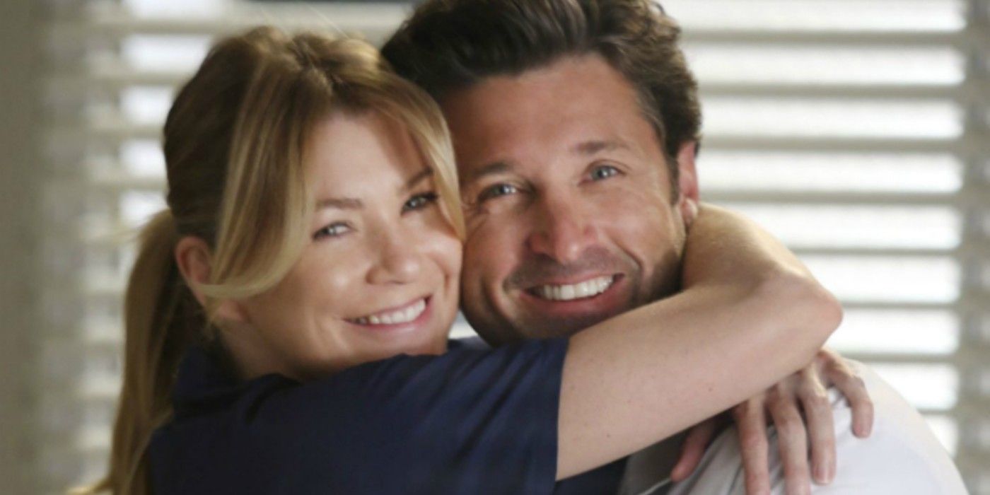 Meredith and Derek hugging and smiling on Grey's Anatomy