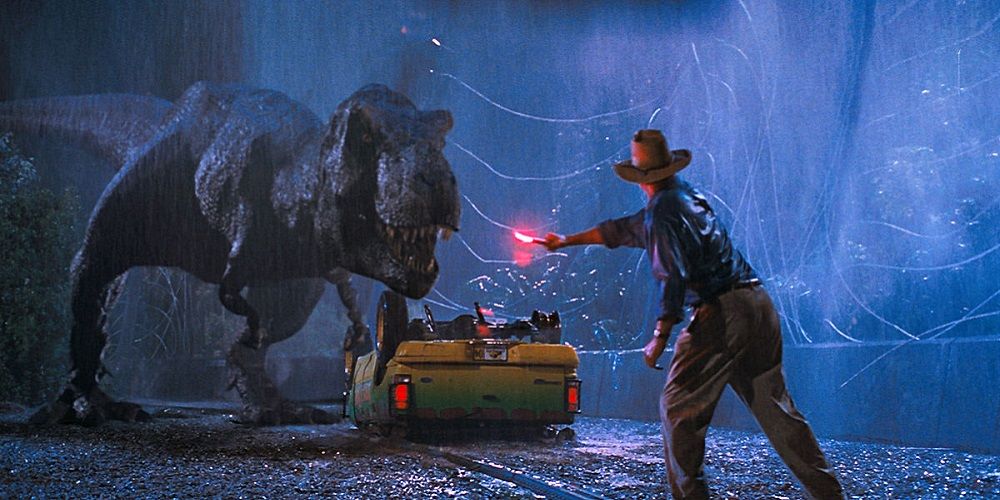Alan Grant flashing a flare in front of a T-rex in Jurassic Park