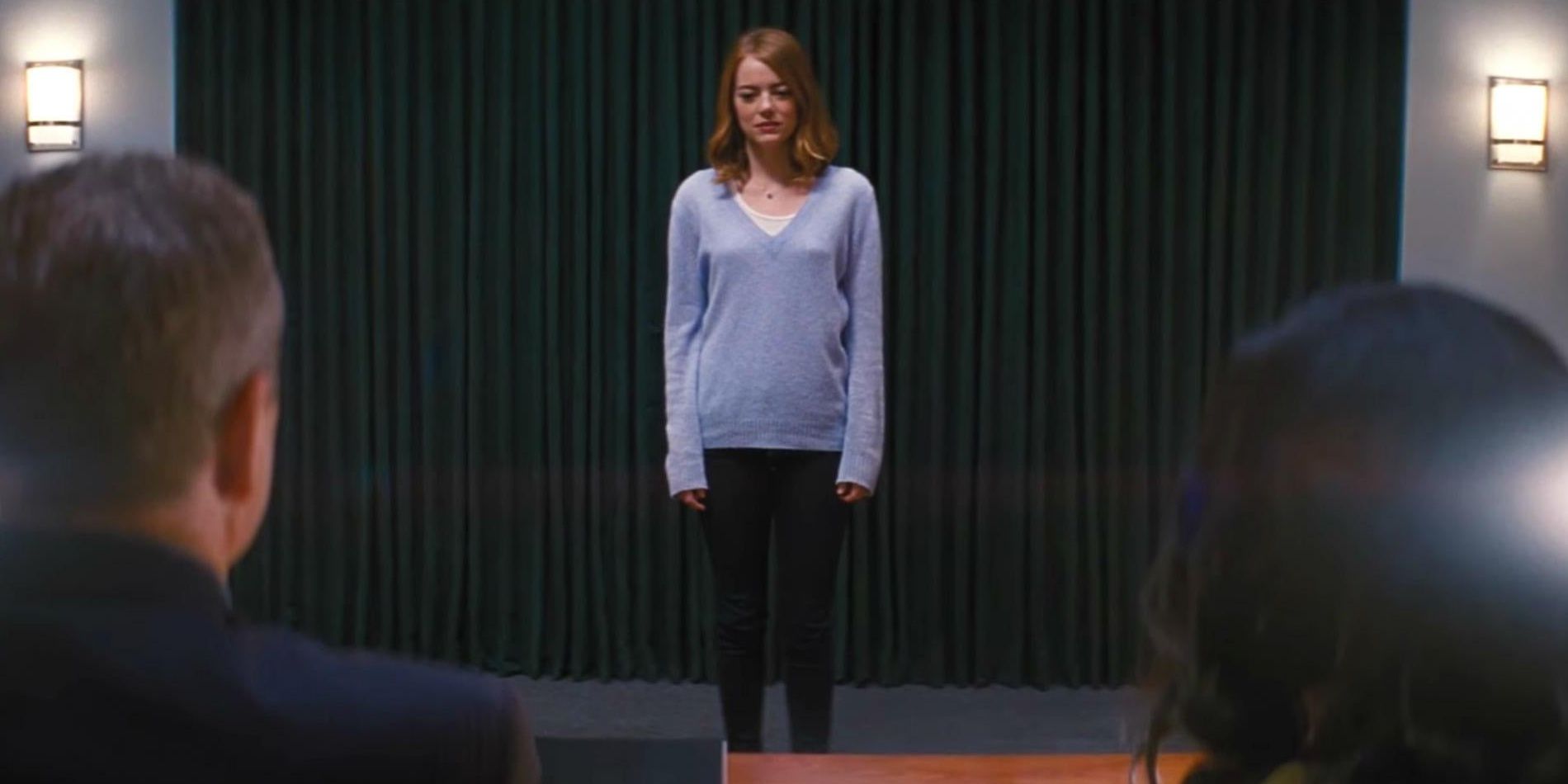 Emma Stone as Mia standing on stage at an audition in La La Land