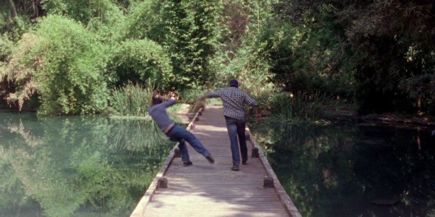 Luke pushing Jess into a lake on Gilmore Girls