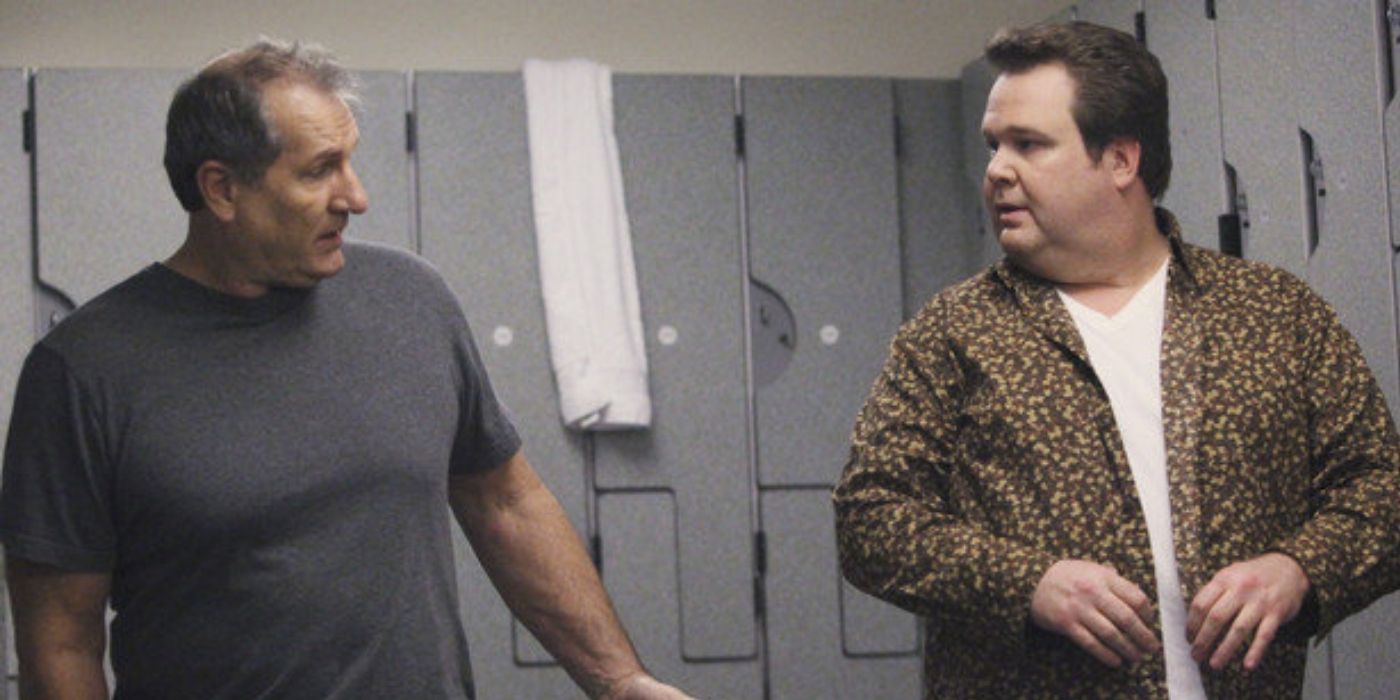 Jay and Cam in the gym locker room in Modern Family