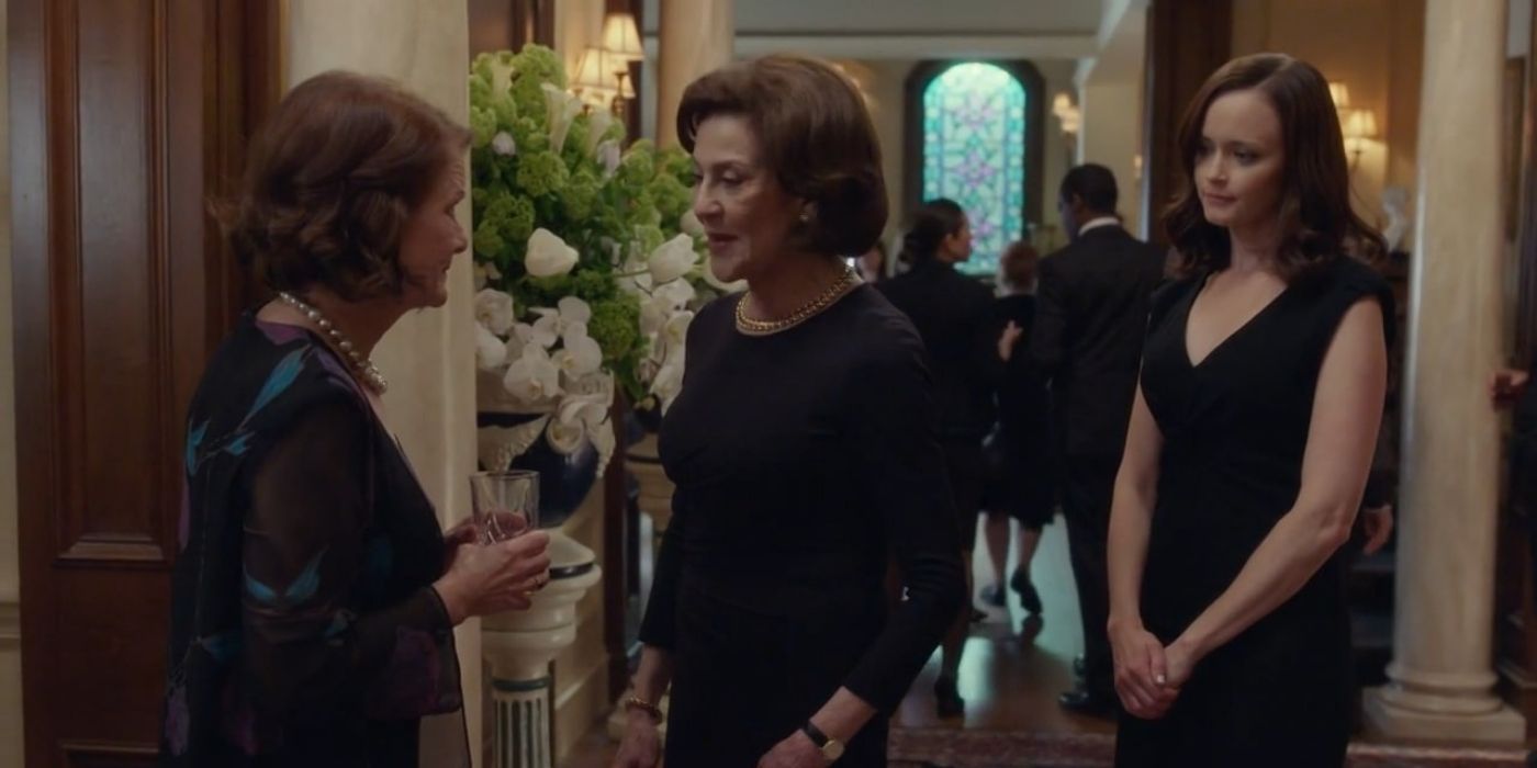 Emily and Rory talking to someone at Richard's funeral in Gilmore Girls: A Year In The Life