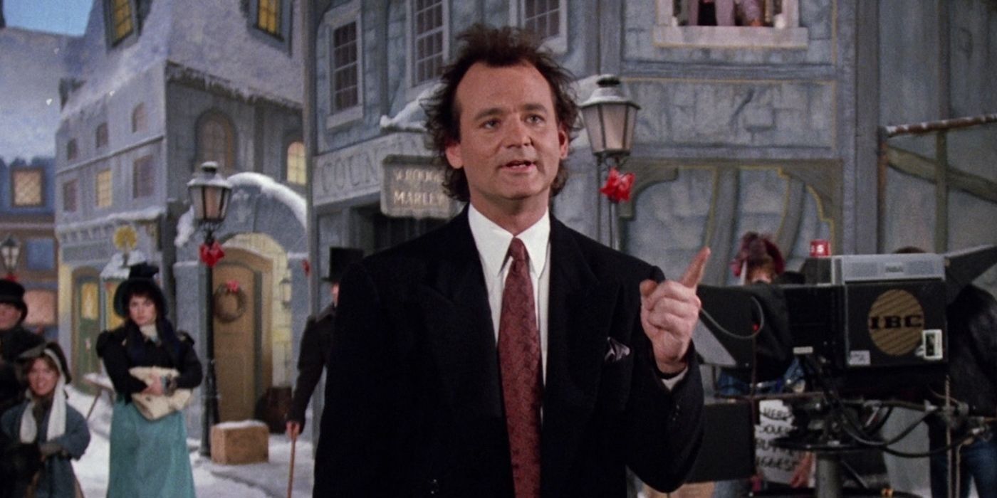 Bill Murray in Scrooged, walking around his set, looking angry.