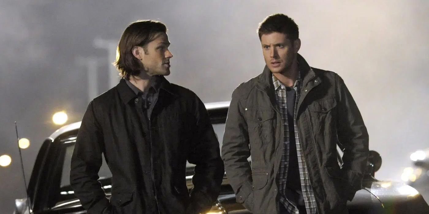 Sam and Dean sit on their car in Supernatural