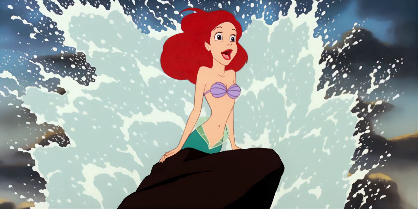 Ariel sings on a rock as water splashes behind her in the Little Mermaid