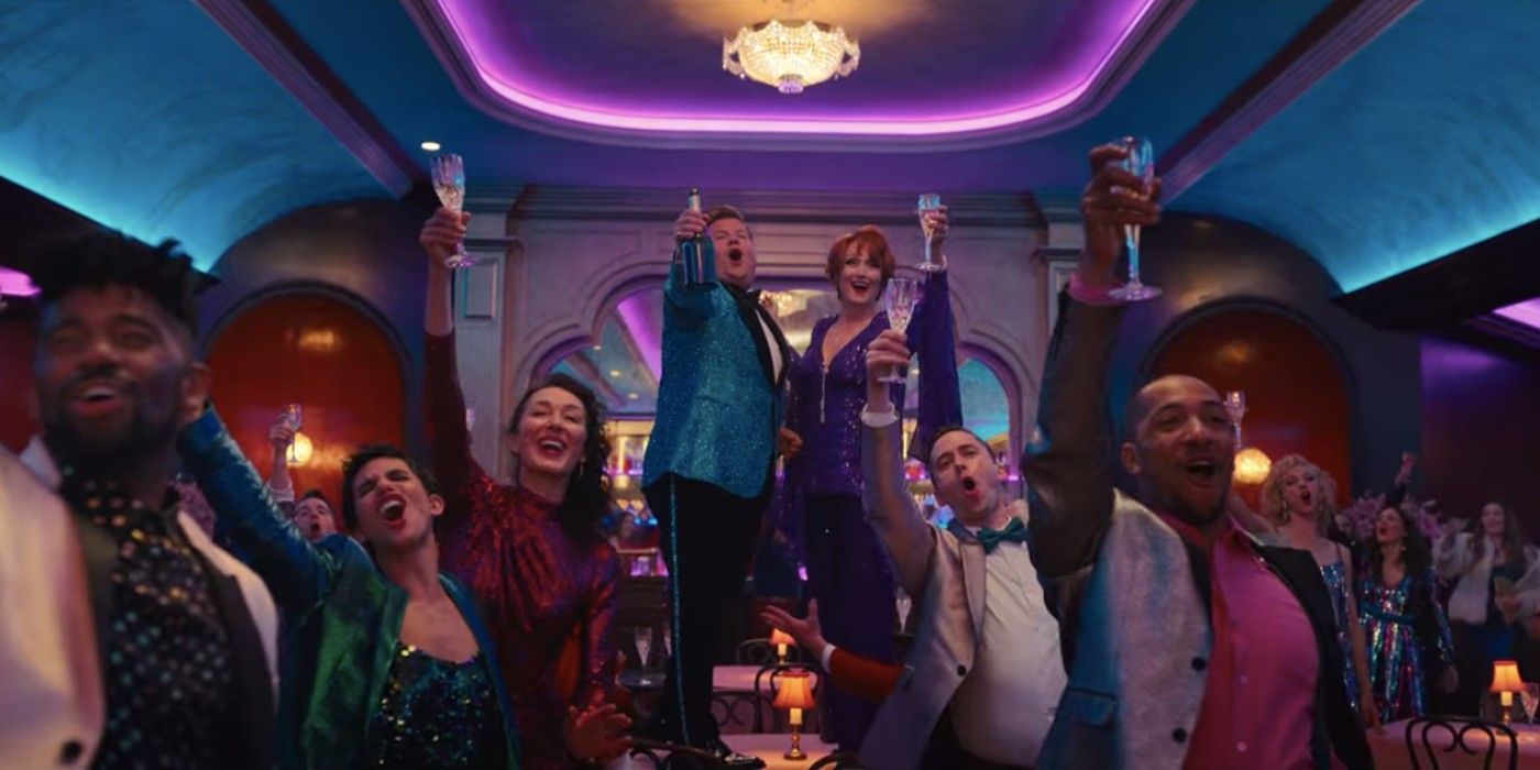 The cast of The Prom raise their glasses during a musical number