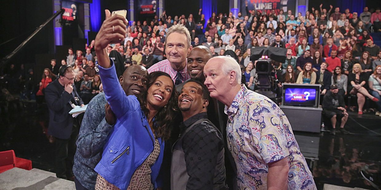 Aisha Tyler taking a selfie on Whose Line is it Anyway
