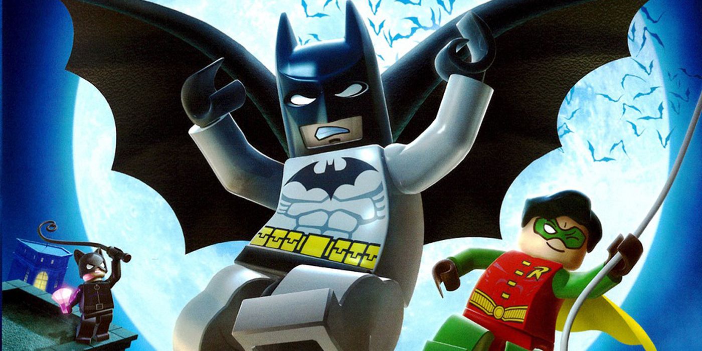 Batman and Robin swinging through the rooftops at night in LEGO Batman: The Videogame