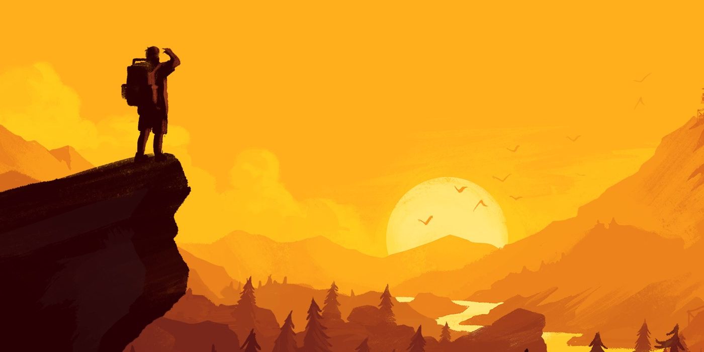 Henry watches the sun set as he stands on the edge of a cliff in Firewatch.
