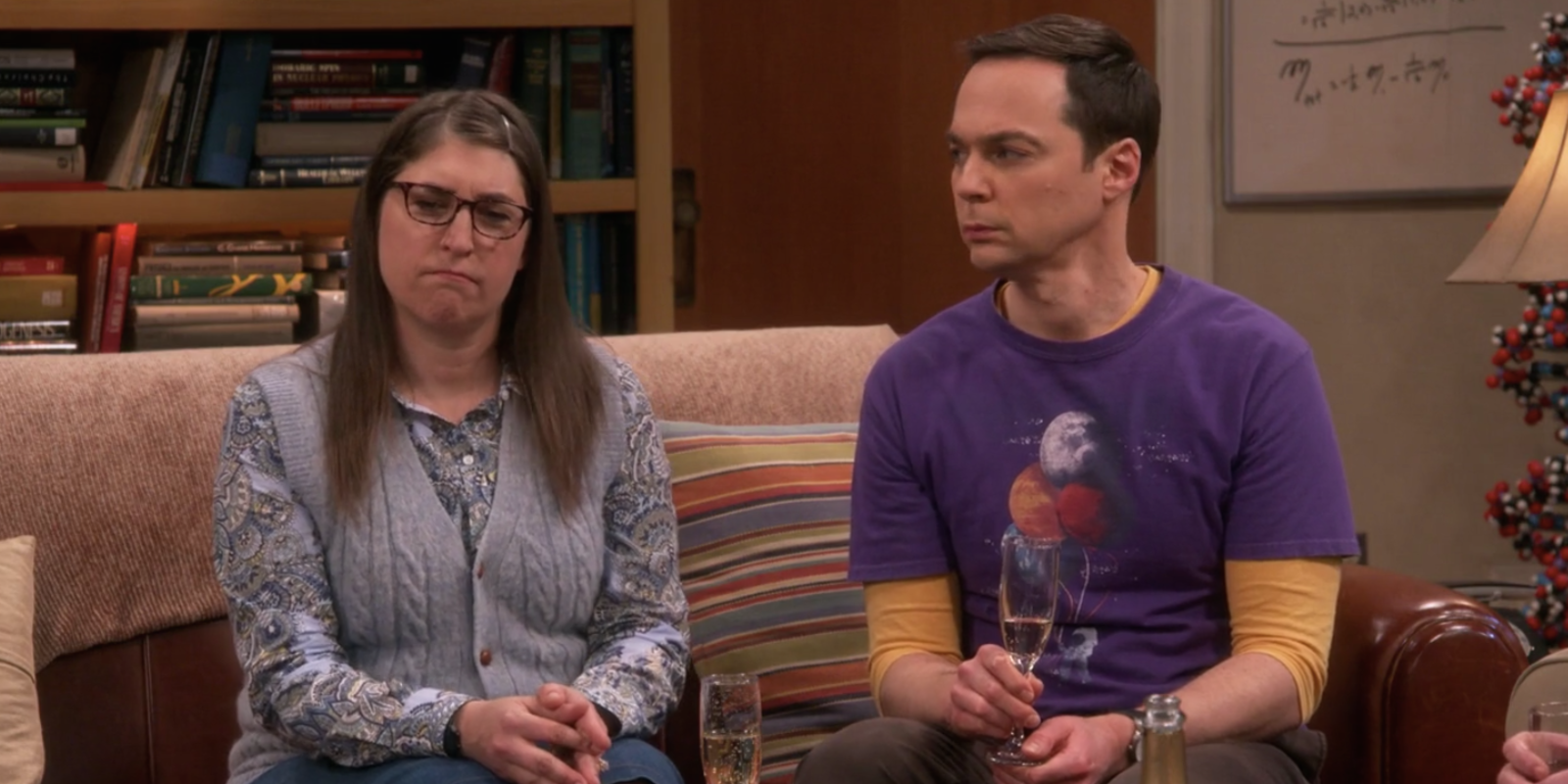 Sheldon and Amy sitting on a sofa