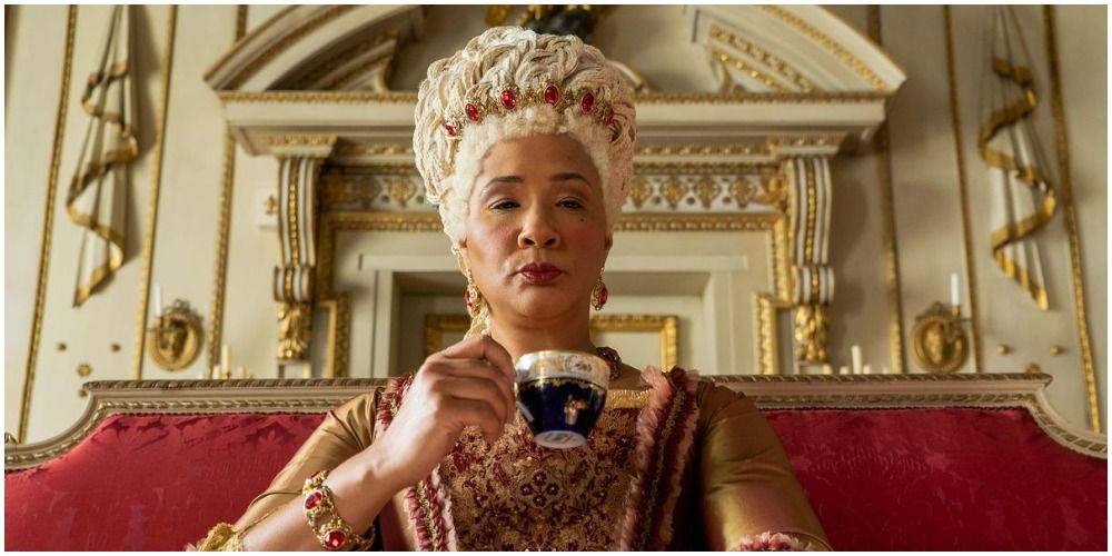 Queen Charlotte drinking tea in her wig in Bridgerton 