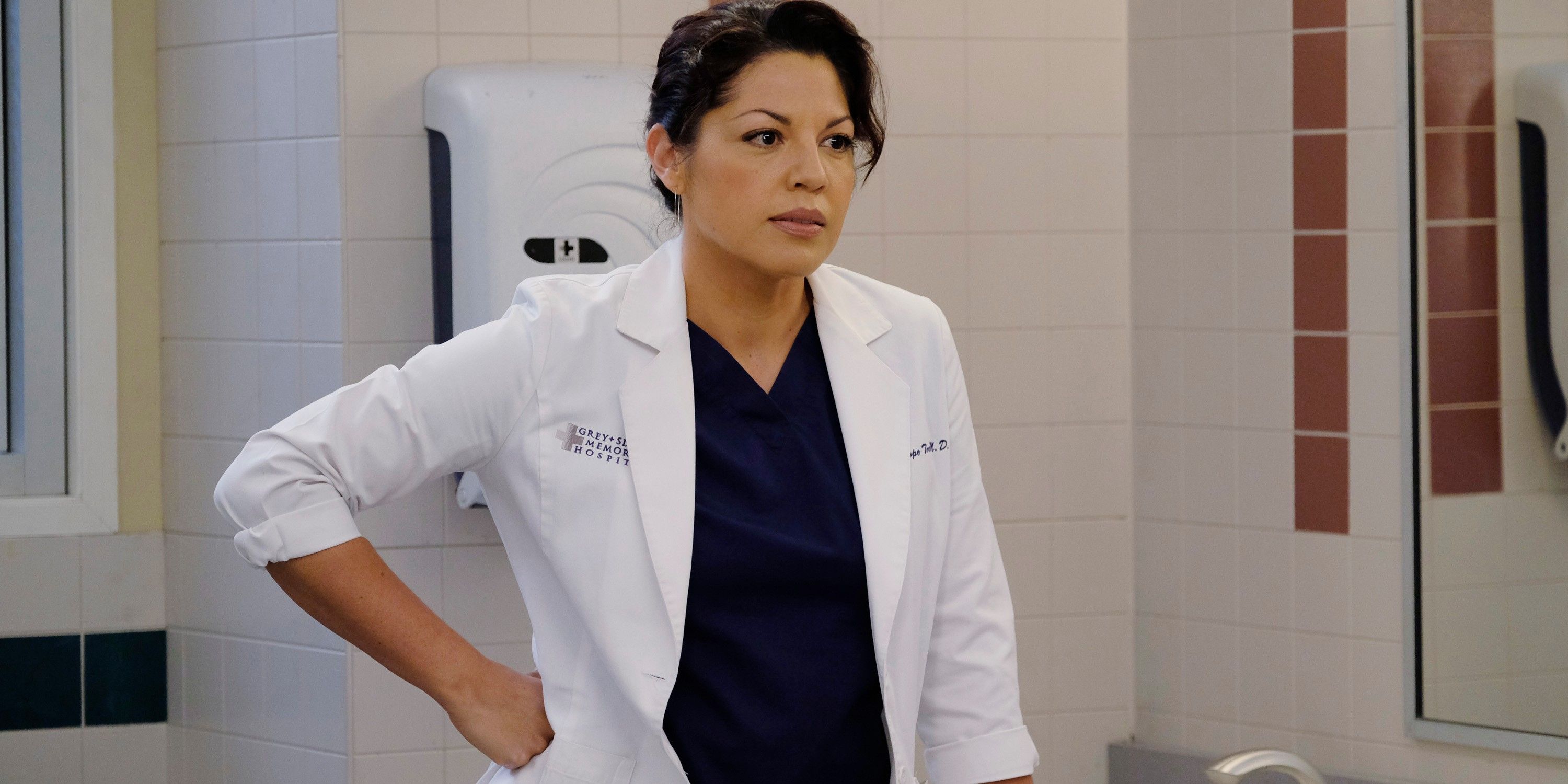 Callie Torres with her hand on her hip