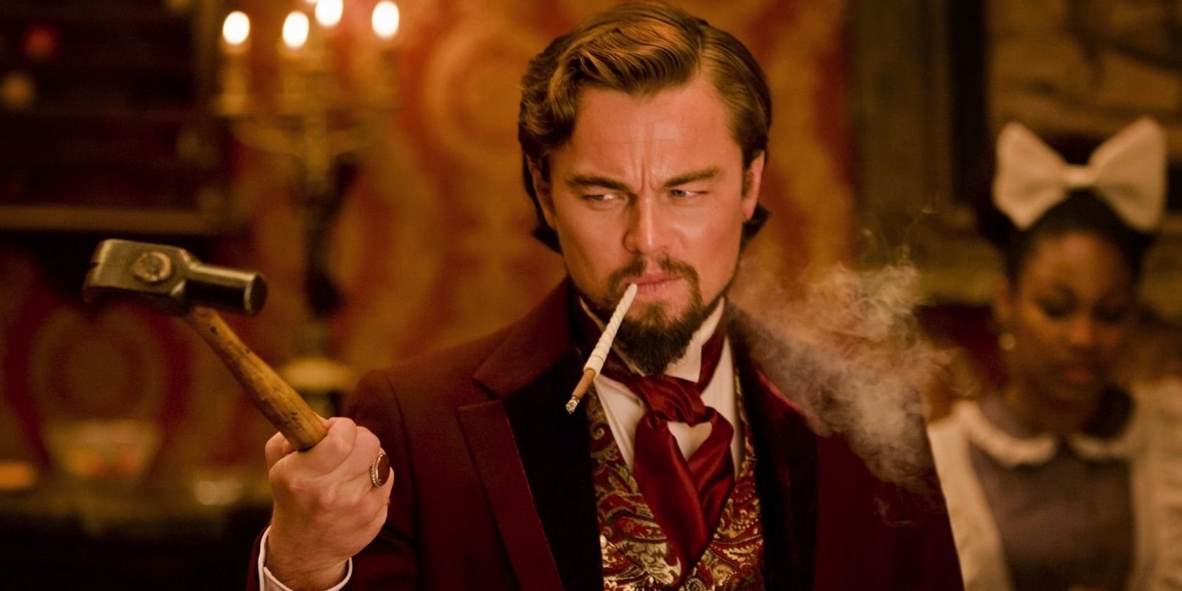 Calvin Candie points with a hammer in Django Unchained