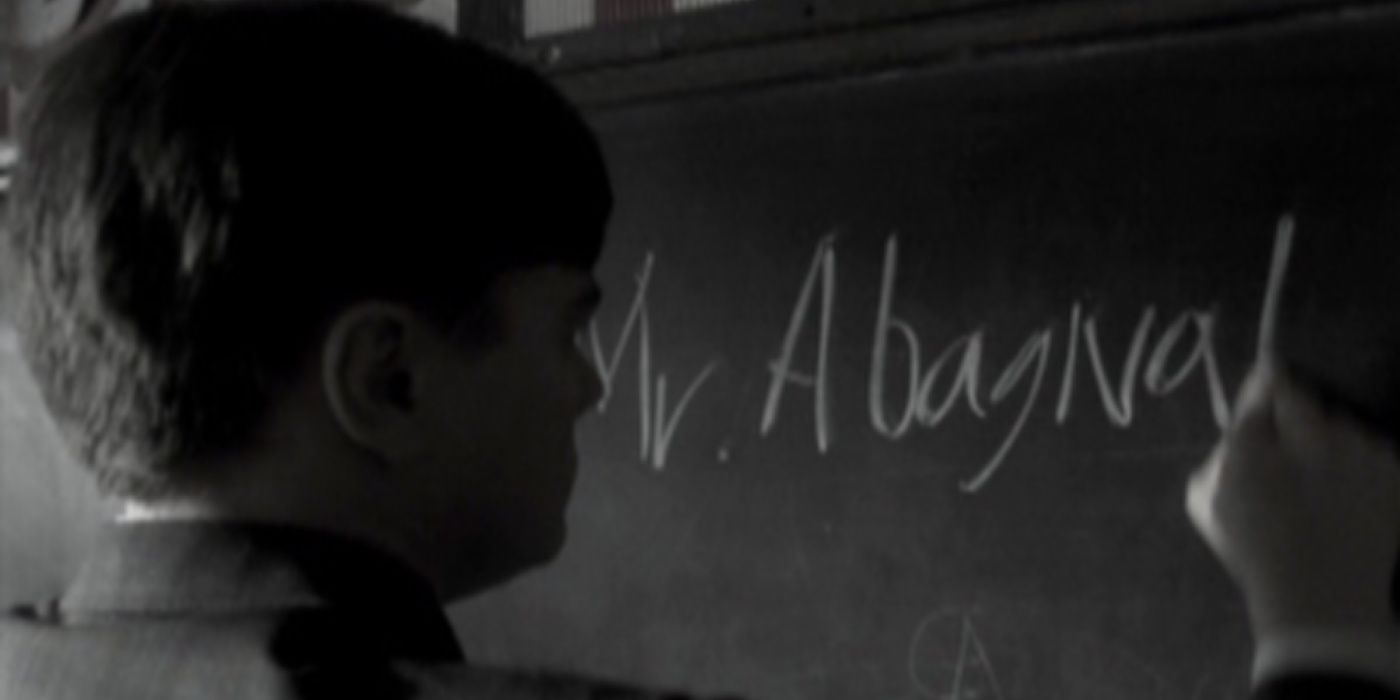 Leonardo DiCaprio writing on a chalkboard in Catch Me If You Can