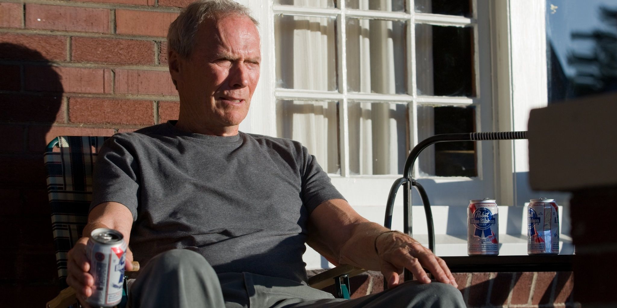 Walt sitting on his porch in Gran Torino