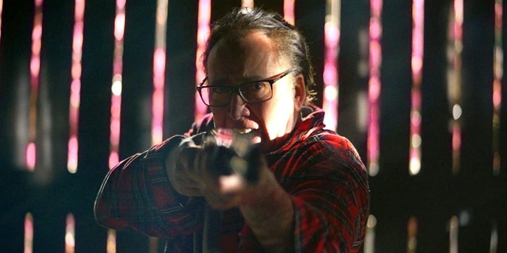 Nicolas Cage with a gun in Color Out Of Space (2019)